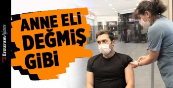  AVM'de annesinin elinden Covid-19 aşısını oldu